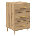 **Moderne nachtkast met drie lades en gouden handgrepen**